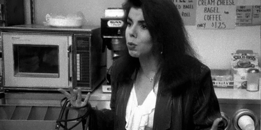 Veronica stands by the microwave and coffee maker in Clerks