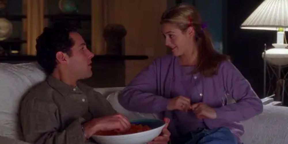 Josh and Cher on the couch in Clueless