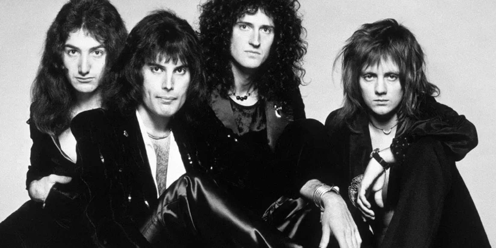 The band Queen appears in a promotional photo from A Night At The Opera.