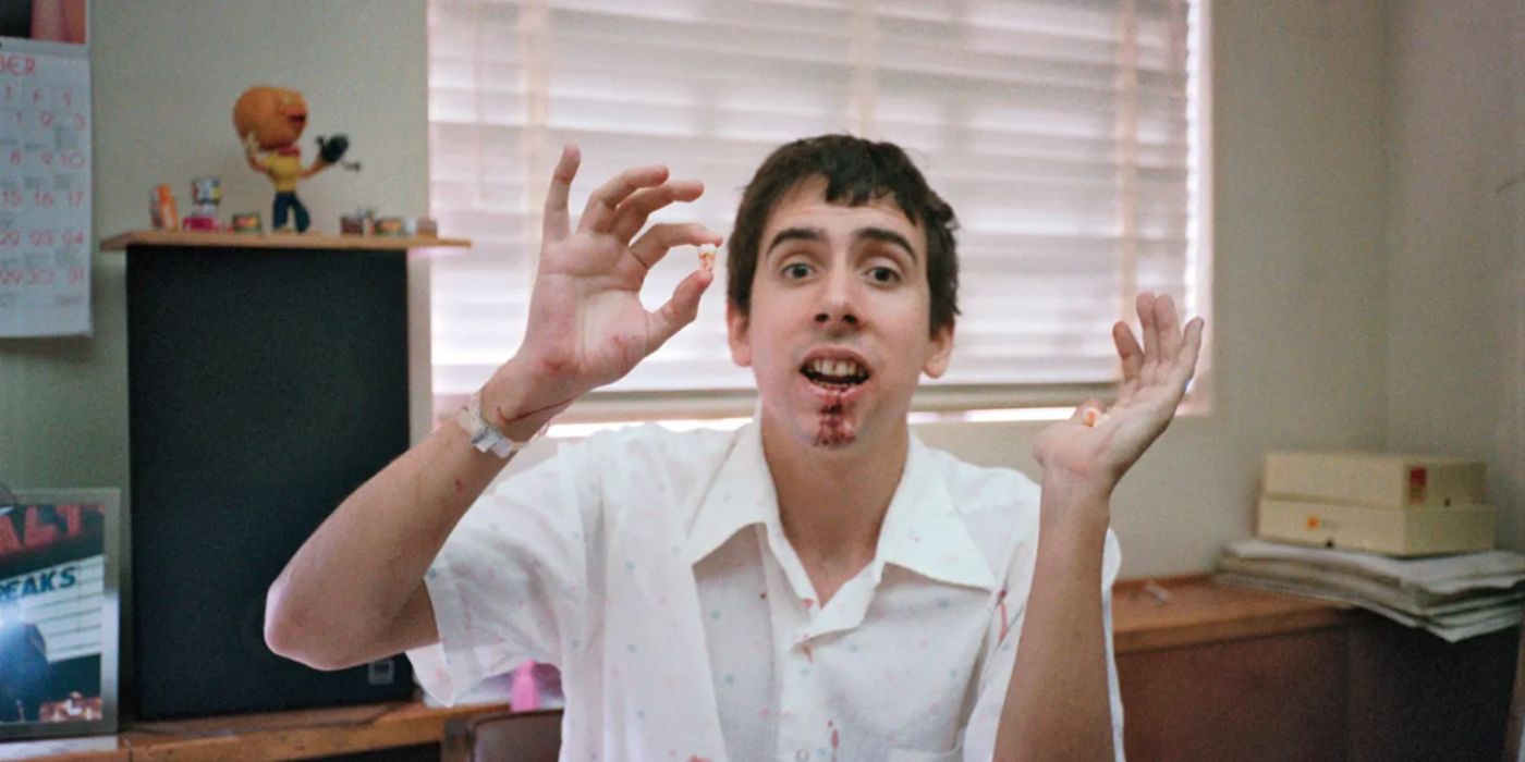 Tim Burton pulls a fake tooth in Waking Sleeping Beauty