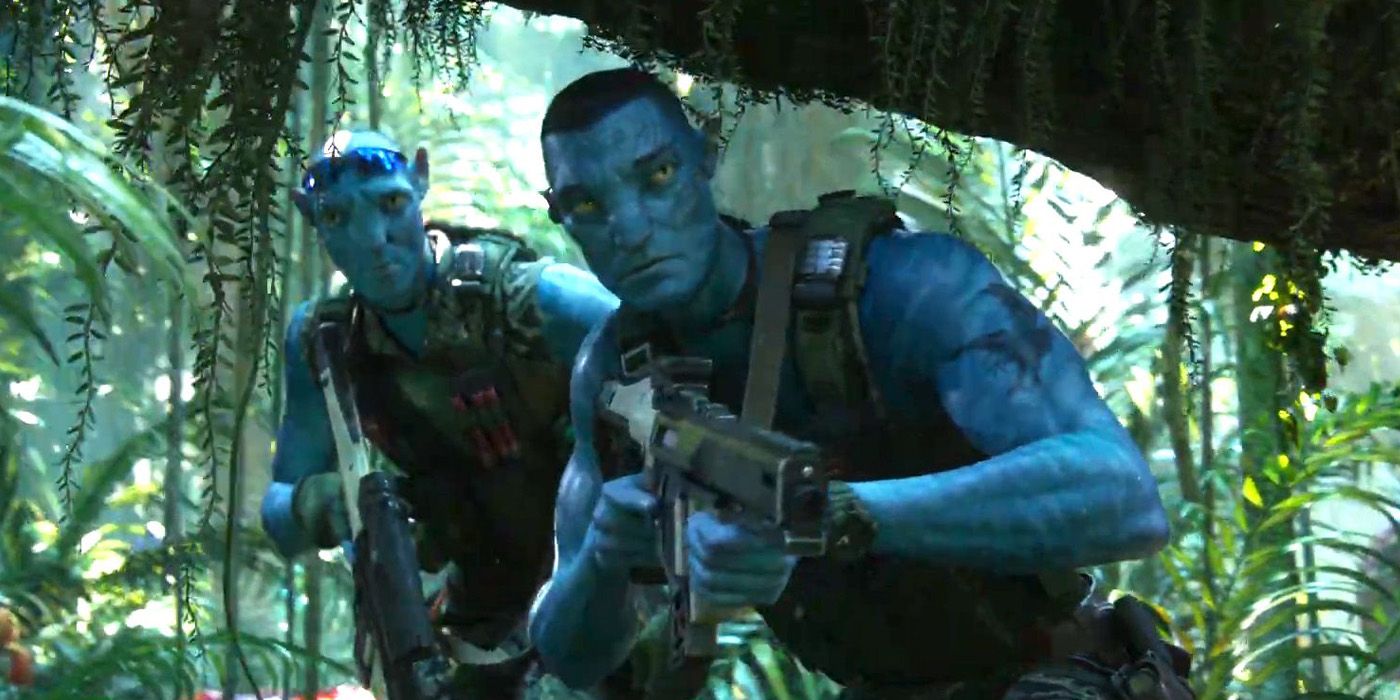 Colonel Quaritch with a colleague walking around the Pandora forest with a gun aimed in Avatar The Way Of Water