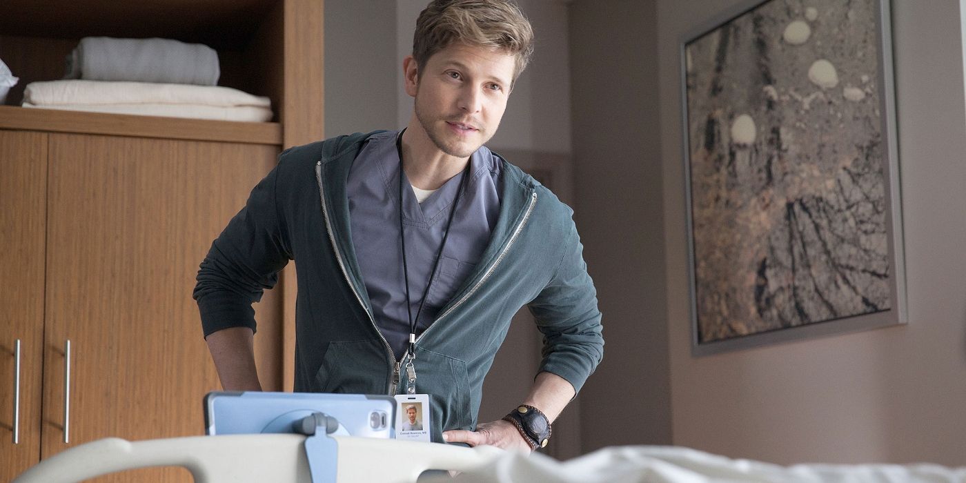 Conrad standing in a hospital room in The Resident