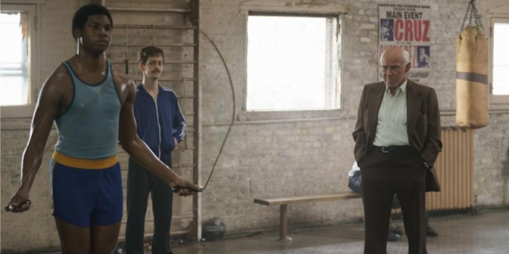 Cus D’Amanto watches a young Tyson train in Mike