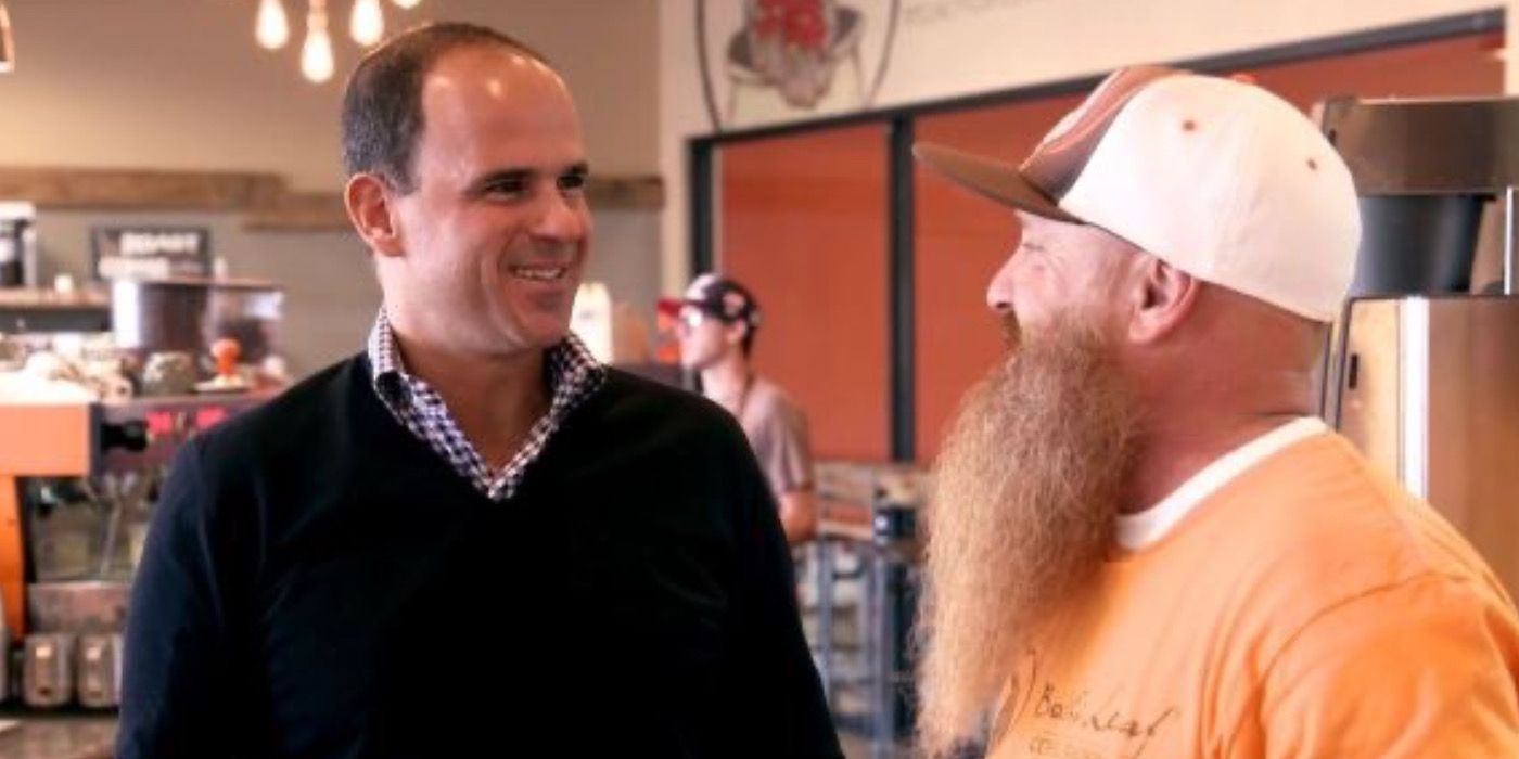 Marcus Lemonis helps a man in The Profit reality show