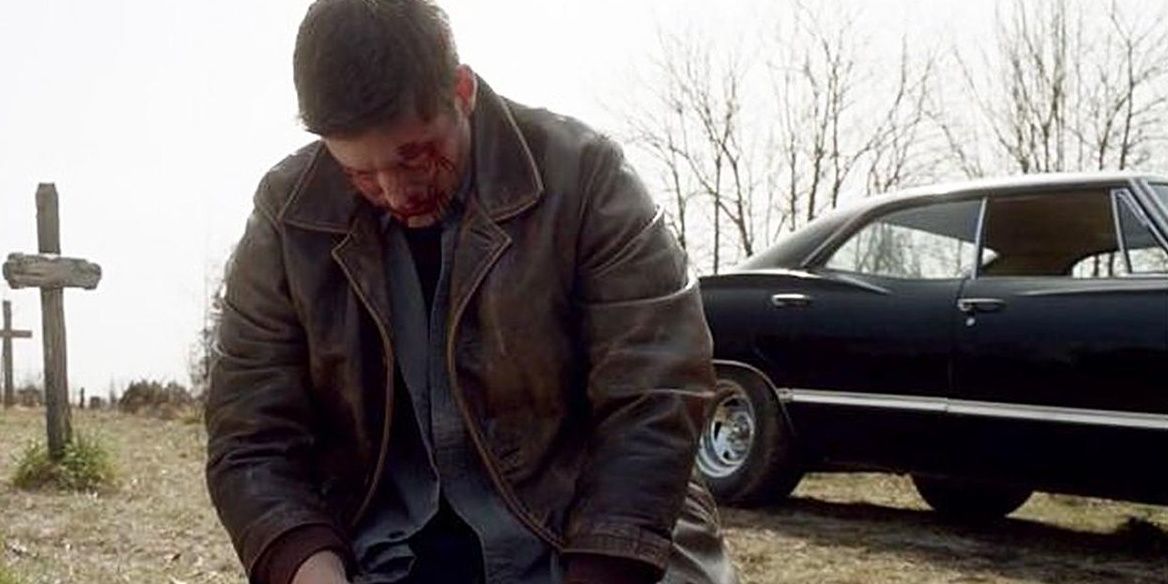 Dean Winchester à genoux et pleurant dans Supernatural 