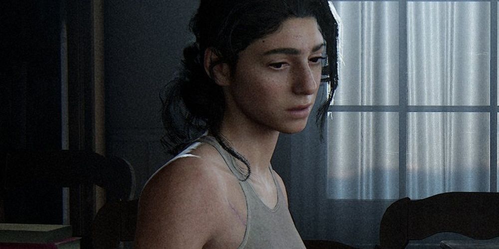 Dina olhando tristemente para baixo em The Last of Us 2 