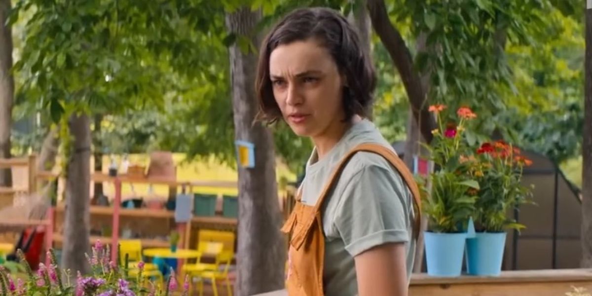 Carissa in her farm overalls in Do Revenge