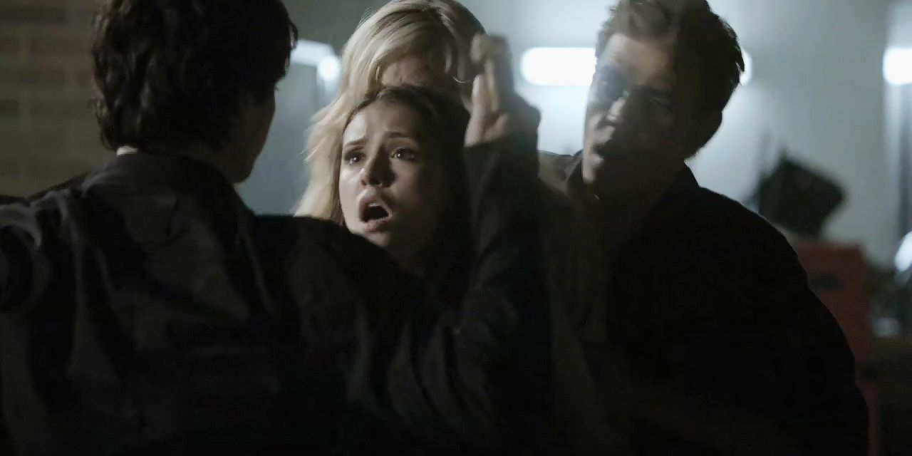 Elena protects Caroline from Damon on The Vampire Diaries