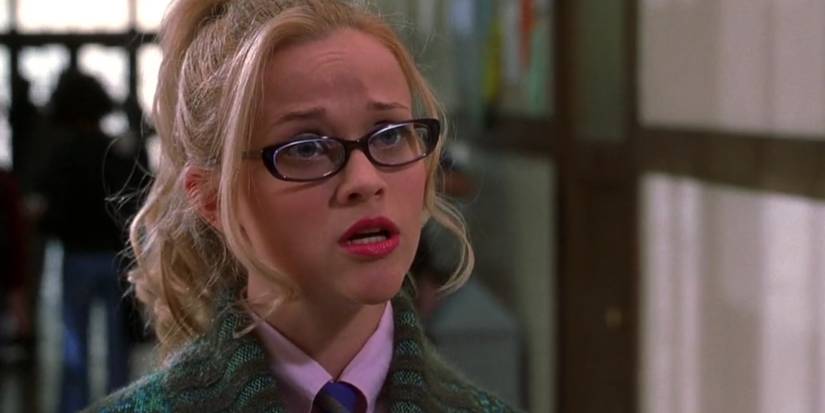 Elle Woods looking shocked in the hallway at Harvard University in Legally Blonde.