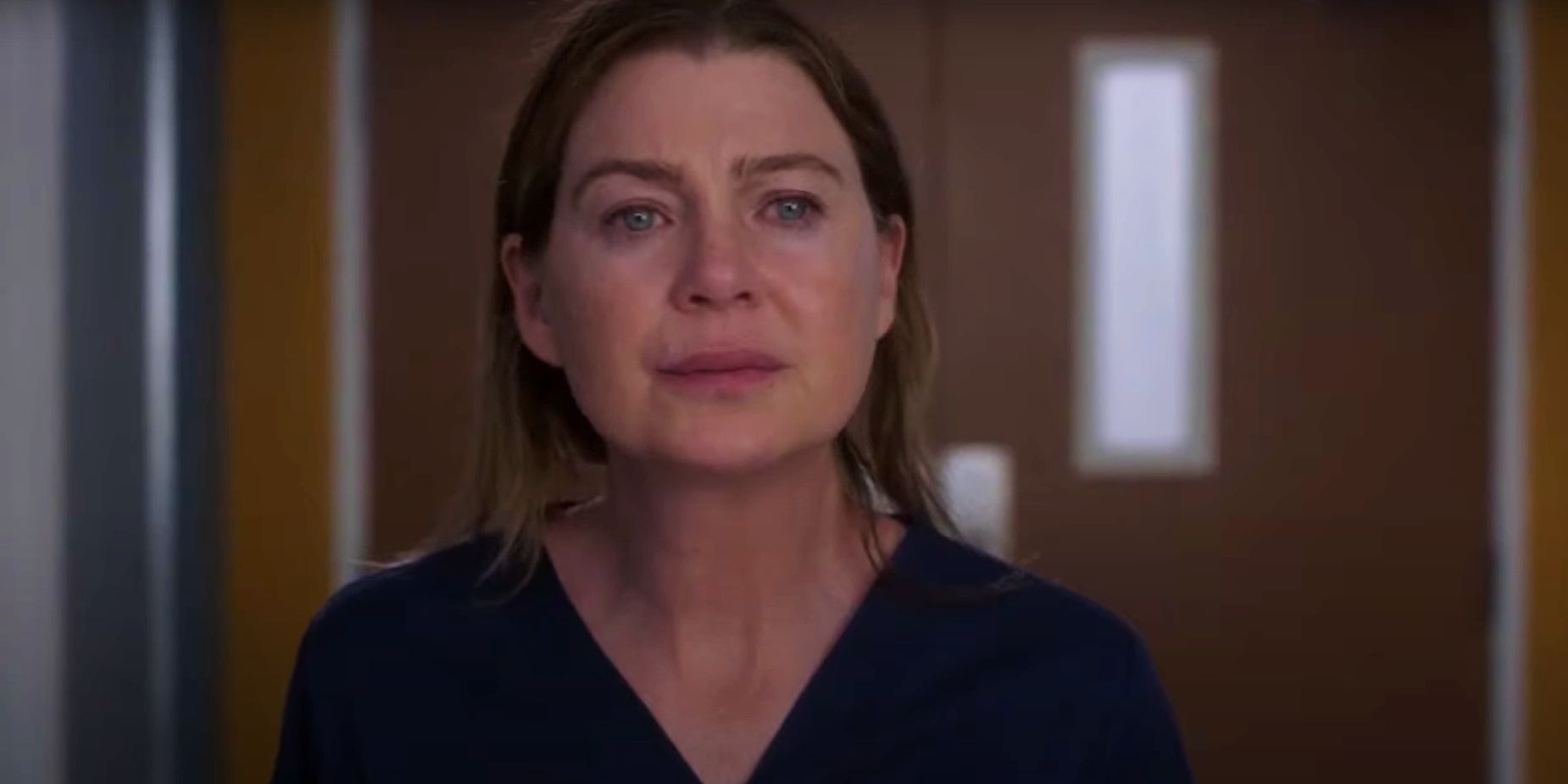 Ellen Pompeo as Meredith Grey standing in hallway in the Grey's Anatomy season 18 finale
