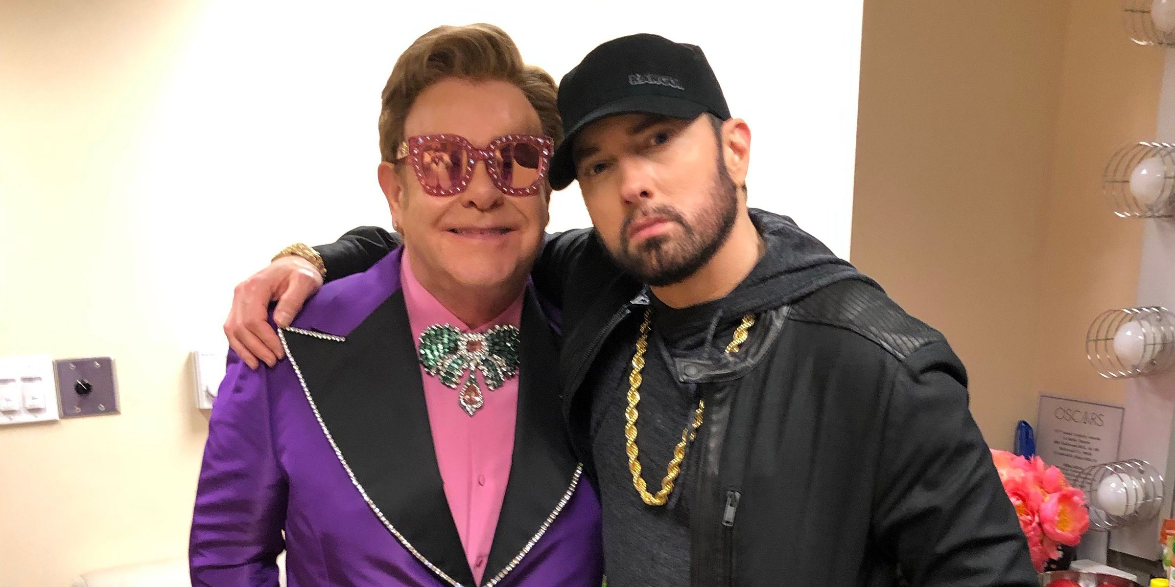 Elton John & Eminem posing for a photo backstage at the Oscars.