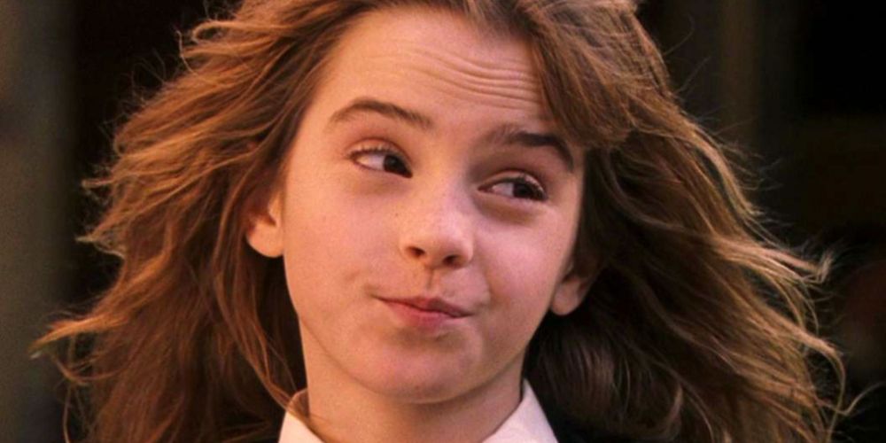 Emma Watson as young Hermione Granger with a sassy expression from Harry Potter.