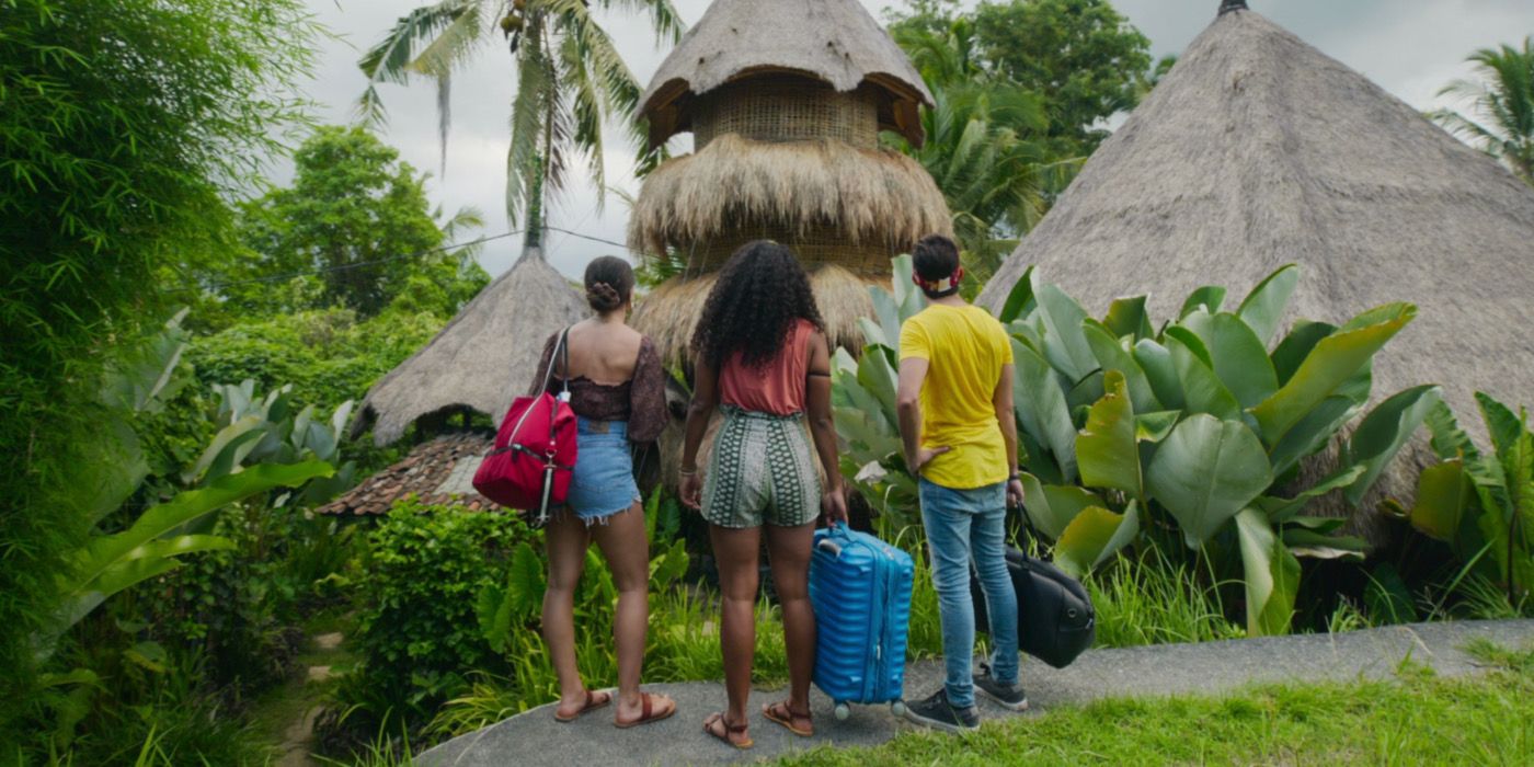 Three hosts stand in front of a beautiful property in World’s Most Amazing Vacation Rentals