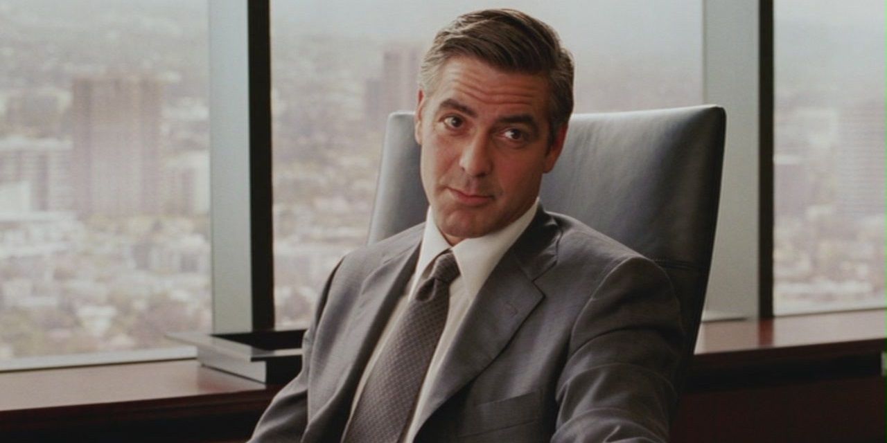 George Clooney sitting in his office in Intolerable Cruelty