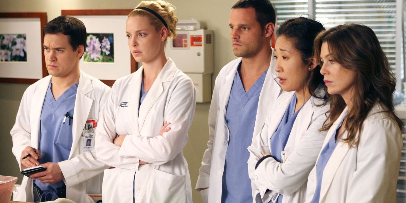 George, Izzie, Alex, Cristina and Meredith looking serious at the hospital on Grey's Anatomy