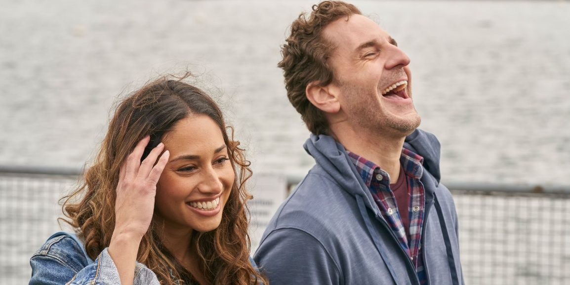 Husband and wife walking and laughing in Children Ruin Everything