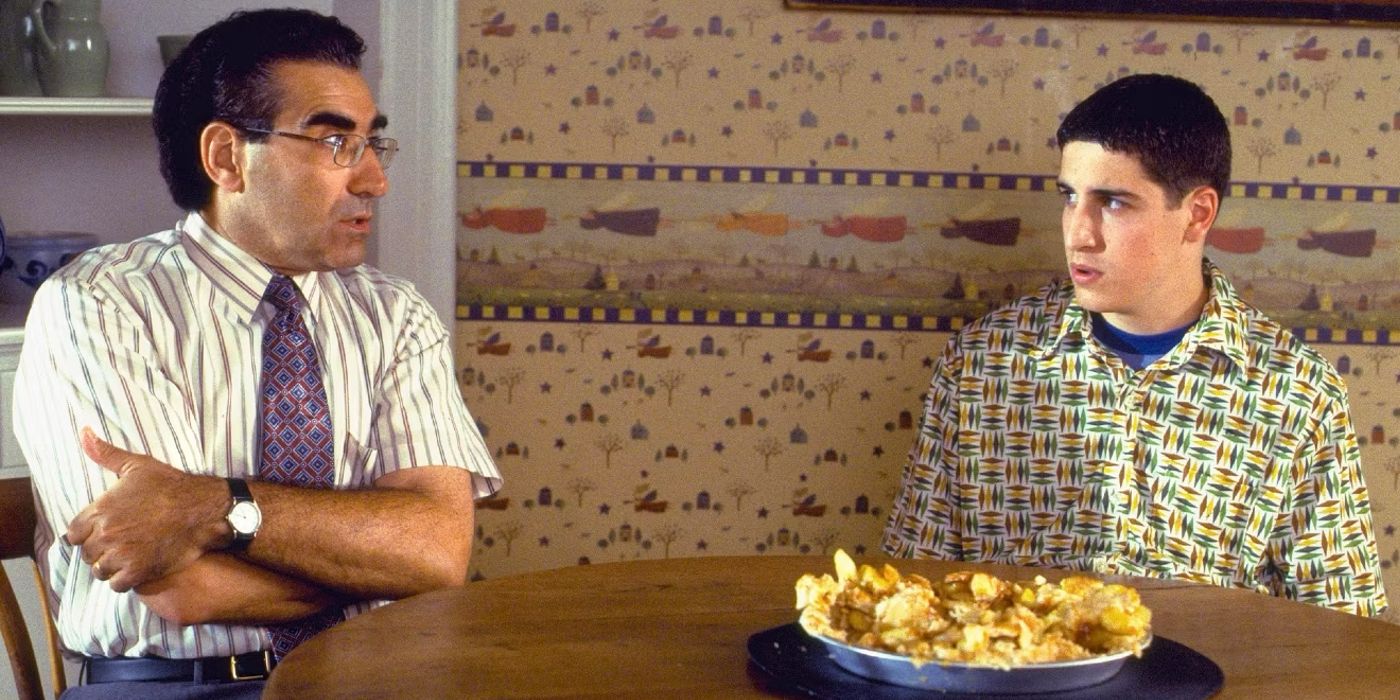 Jason Biggs and Eugene Levy sitting down with a destroyed apple pie in American Pie