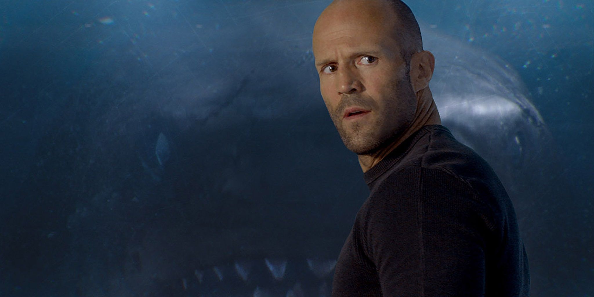 Jason Statham with a giant shark in The Meg