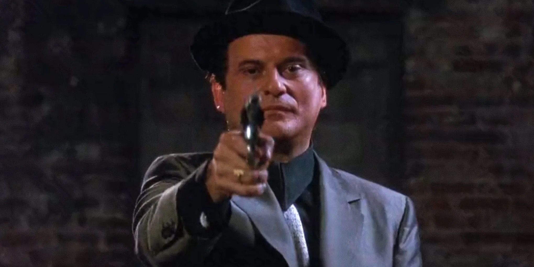 Tommy DeVito pointing a gun at the camera in Goodfellas (1990)
