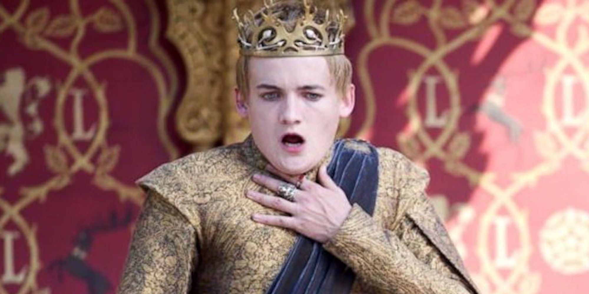 Jack Gleeson dans le rôle de Joffrey Baratheon tenant la main à la gorge dans Game of Thrones