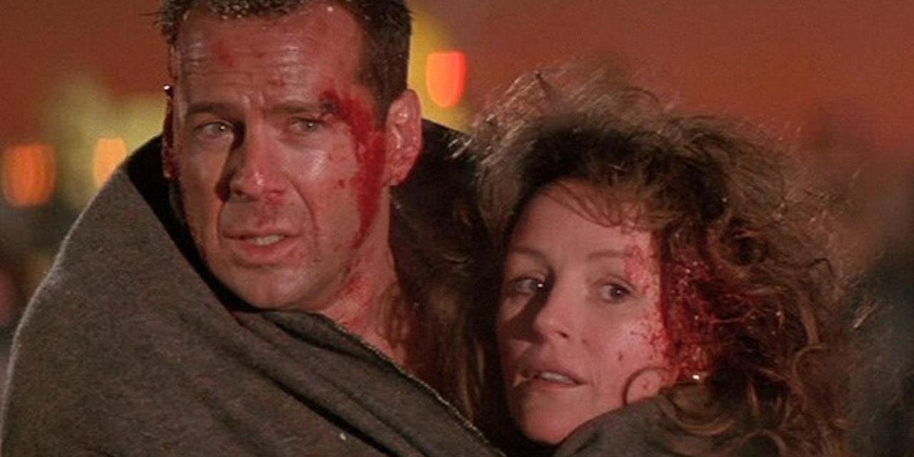 John McClane huddled with Holly at the end of Die Hard