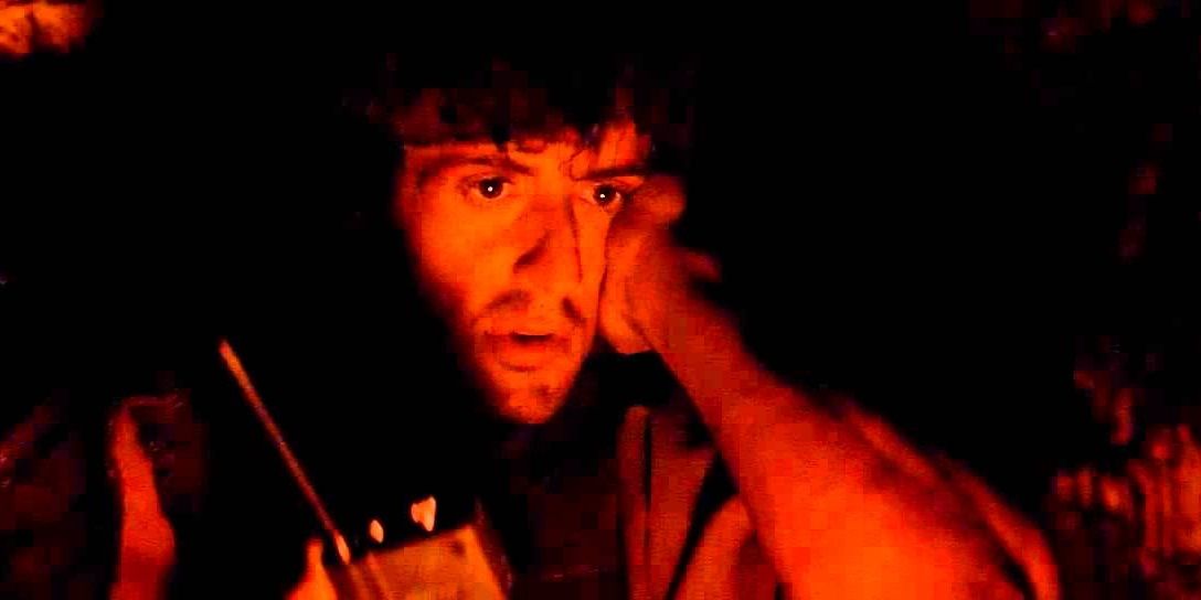 John Rambo hiding in a cave in First Blood