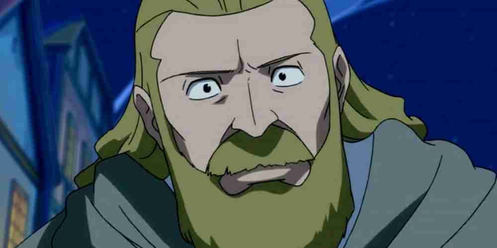 Jude Heartfilia has a blonde beard and is wearing a robe in Fairy Tail.