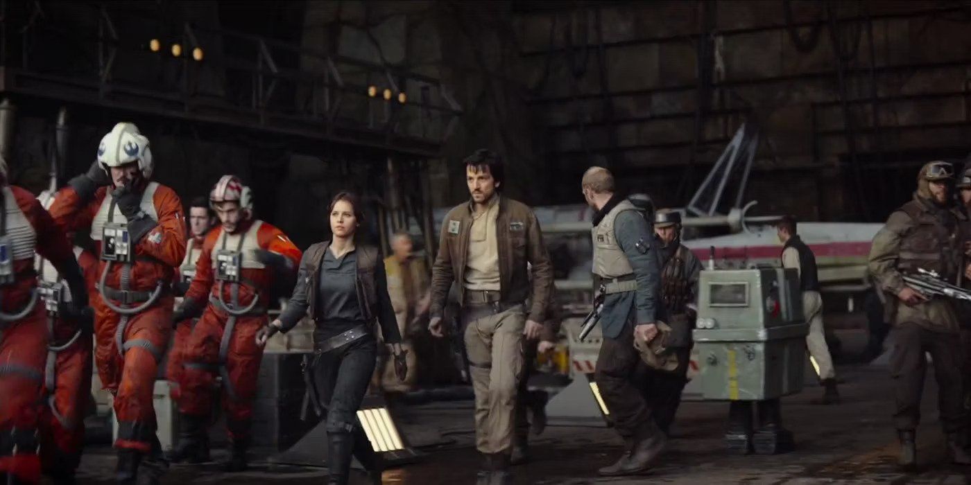 Jyn and Cassian with rebels at the rebel base Rogue One