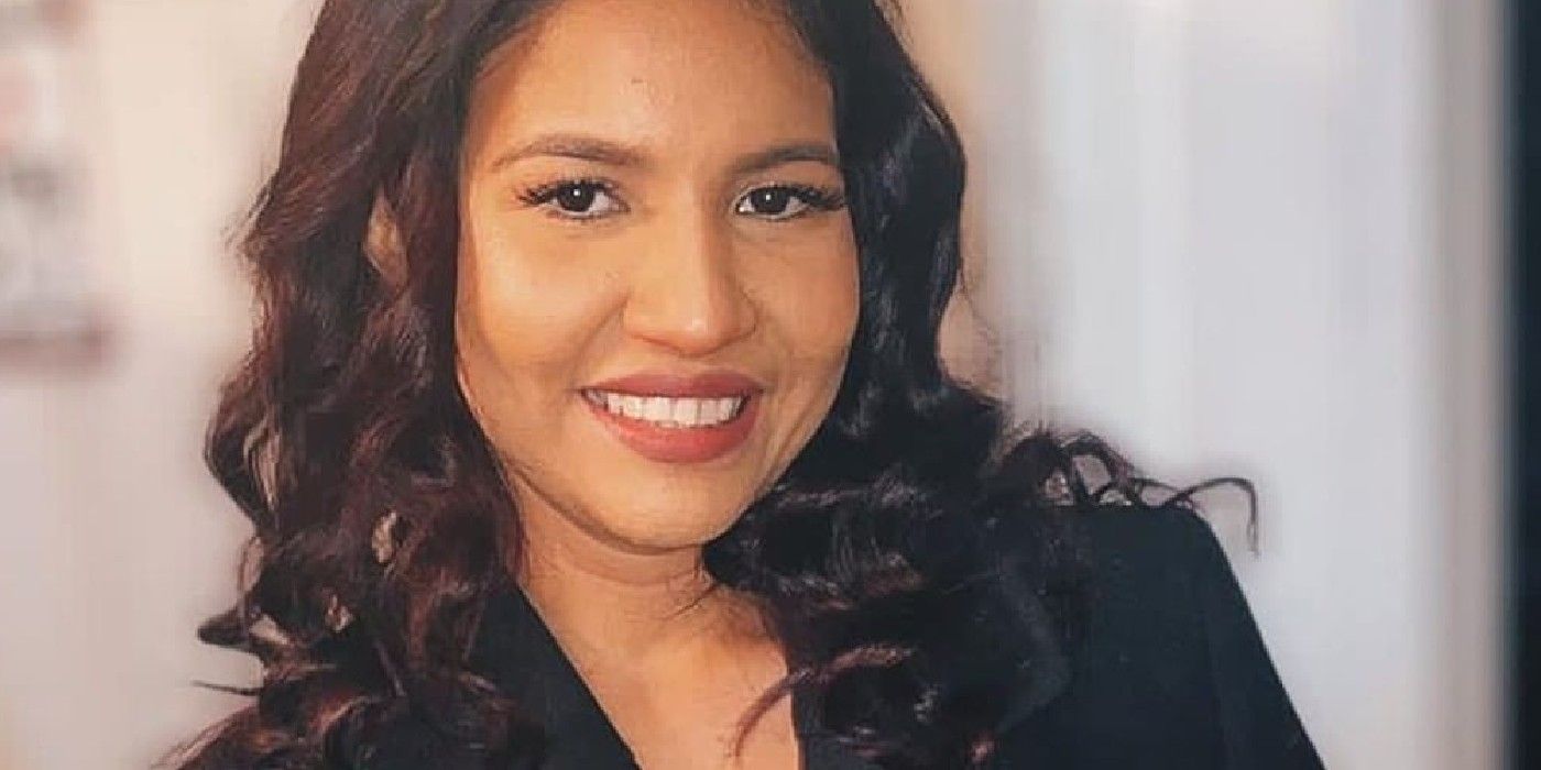 Karine Martins from 90 Day Fiancé smiling in black jacket