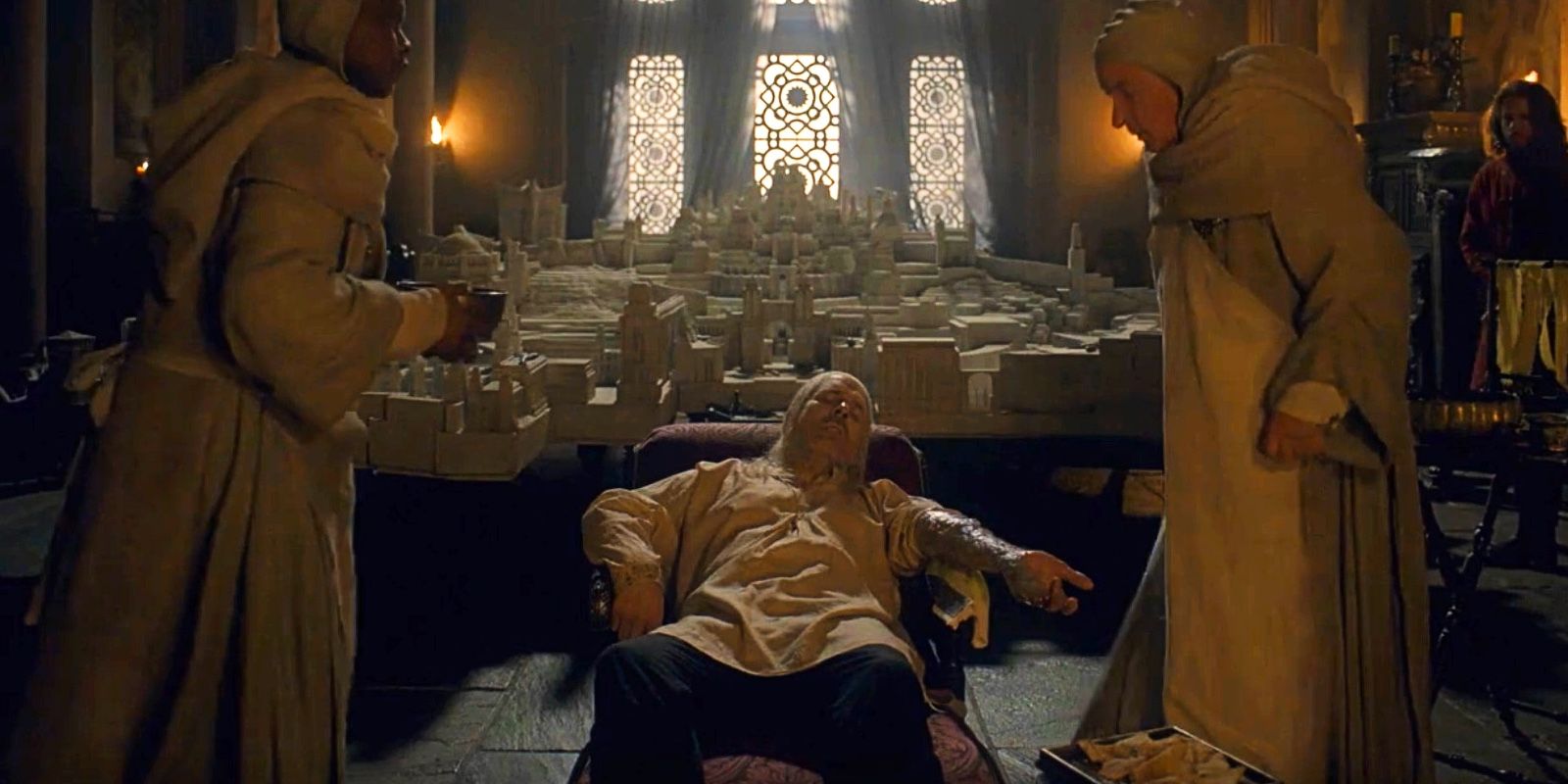 King Viserys I Targaryen getting medical treatments in House of the Dragon