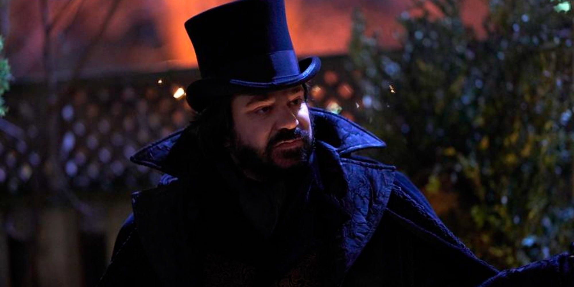 Laszlo wearing a top hat at night in What We Do in the Shadows