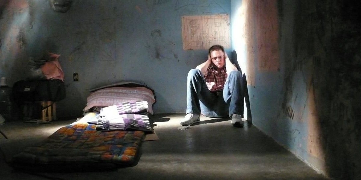 A man sitting in the corner of a cell in Locked Up Abroad
