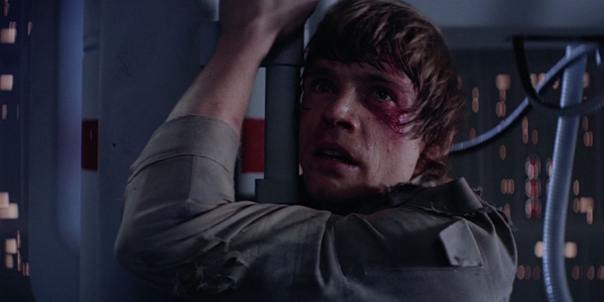 Luke clings to a ledge on Cloud City in The Empire Strikes Back