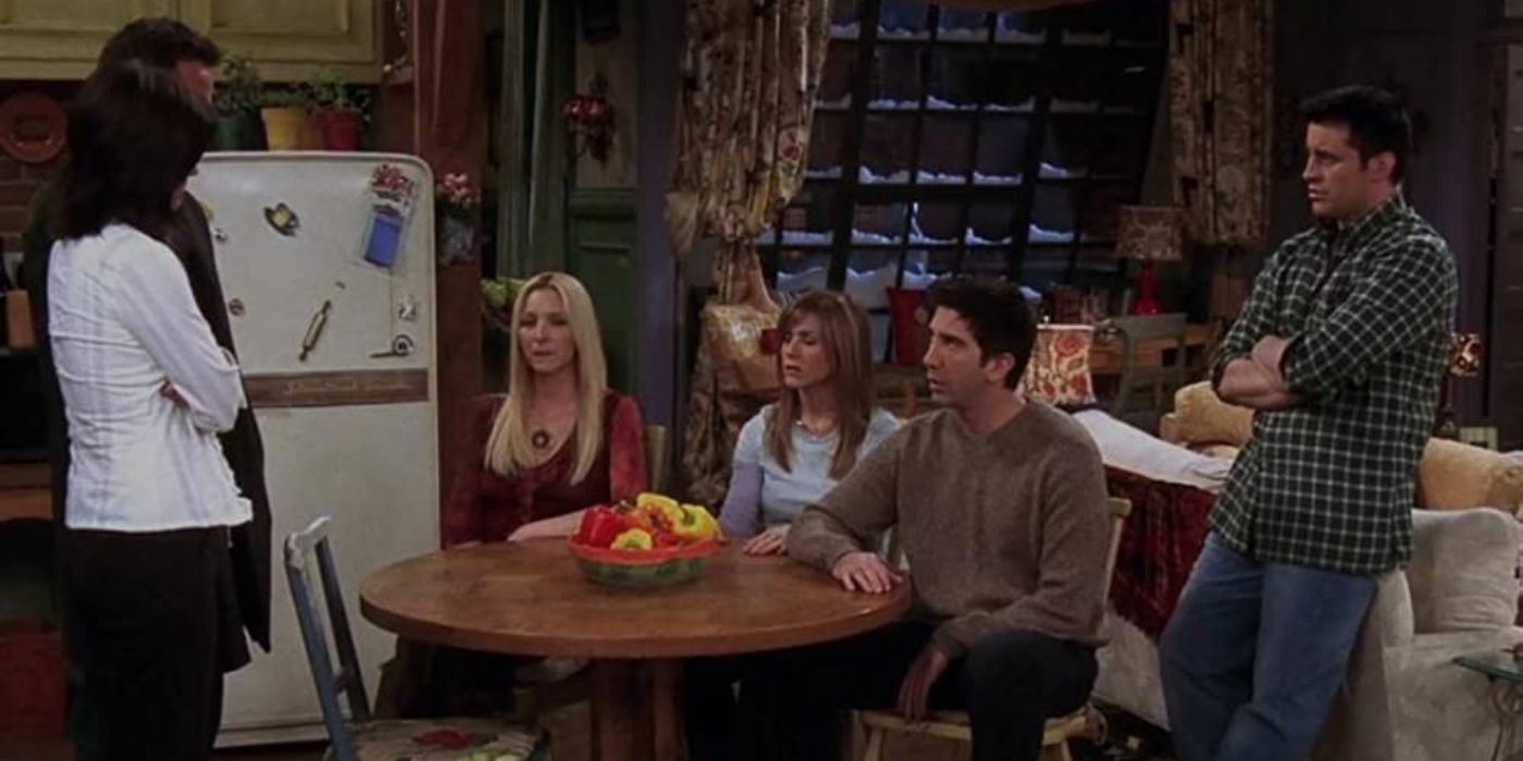 The gang sit in Monica's kitchen in The One Where Chandler Gets Caught in Friends
