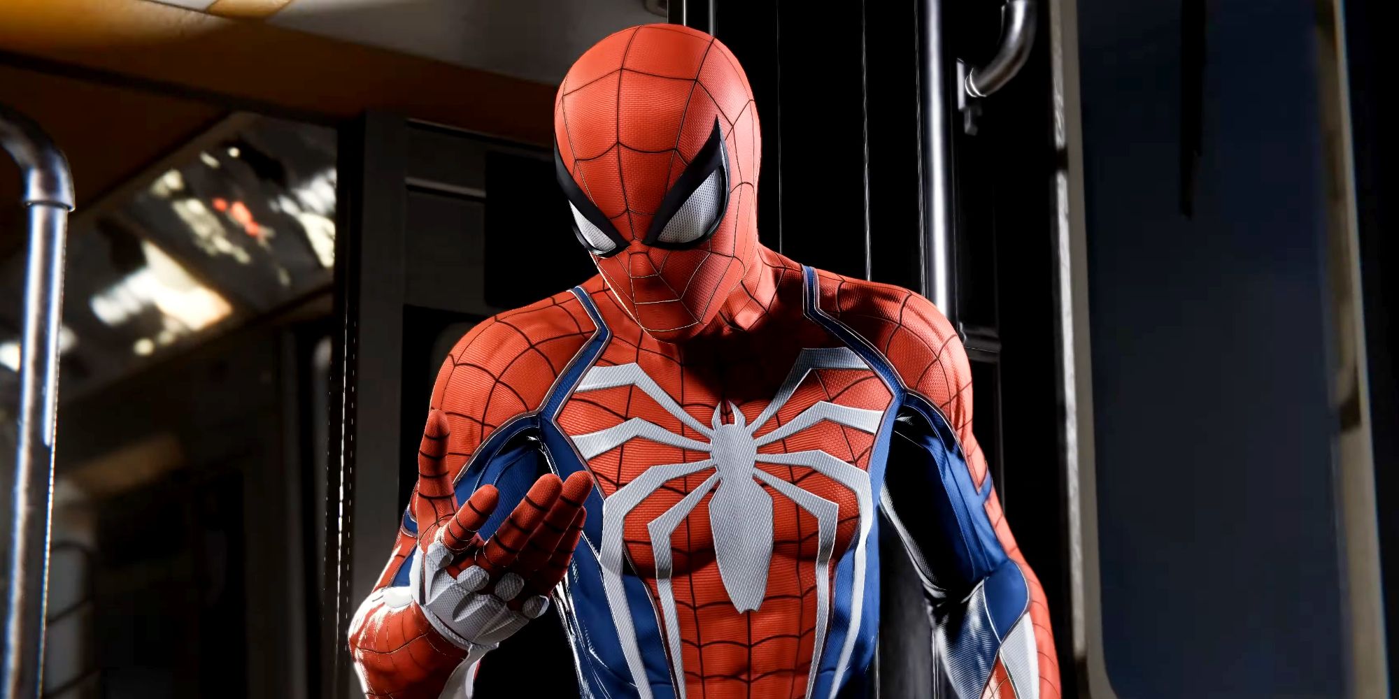 Spider-Man looking at his hand while riding the subway in Marvel's Spider-Man Remastered