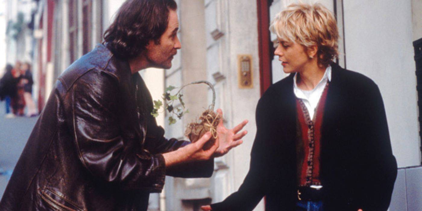 Meg Ryan Kevin Kline discute na rua parisiense em French Kiss (1995)