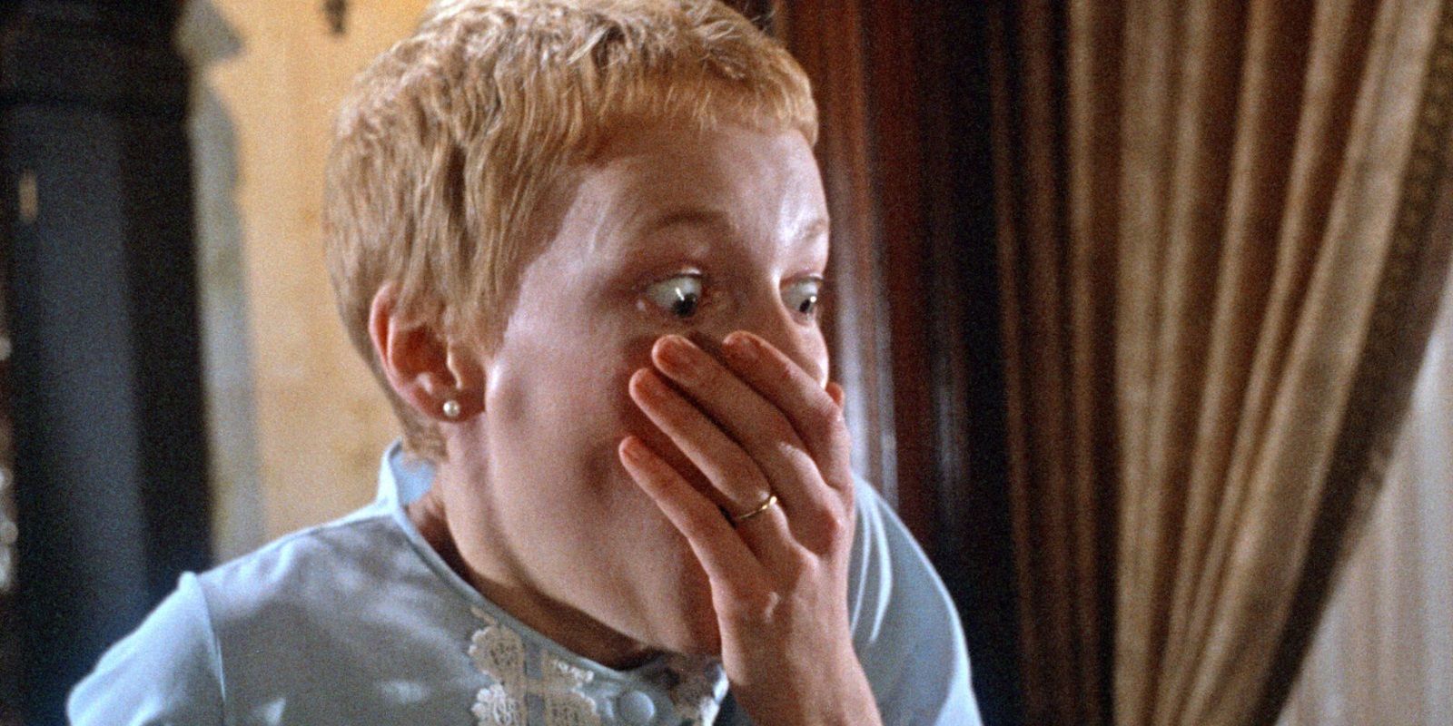Mia Farrow looks on in shock at the end of Rosemary's Baby