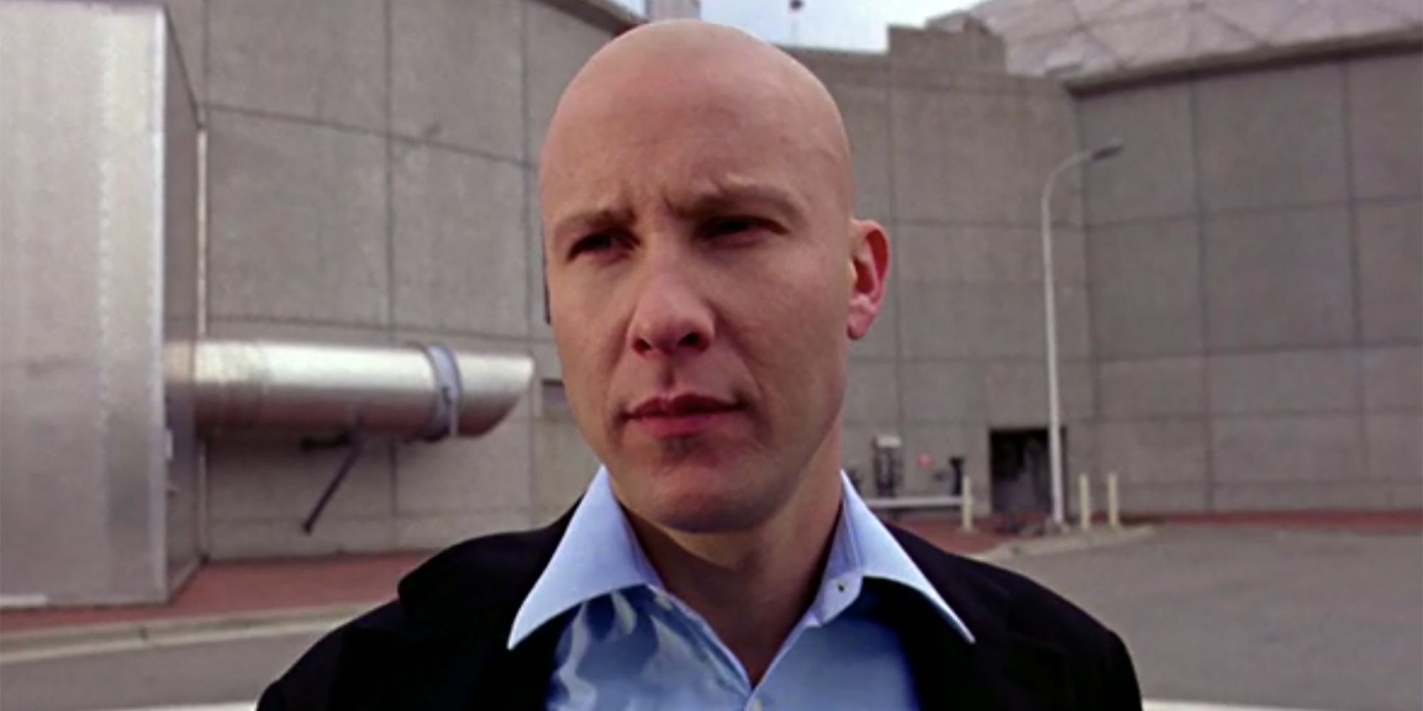 A close-up Michael Rosenbaum as Lex Luthor in an industrial setting in Smallville