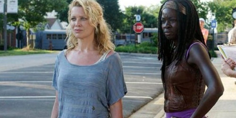 Michonne and Andrea standing on a street in The Walking Dead