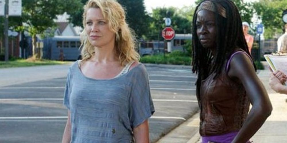 Michonne and Andrea standing on a street in The Walking Dead 