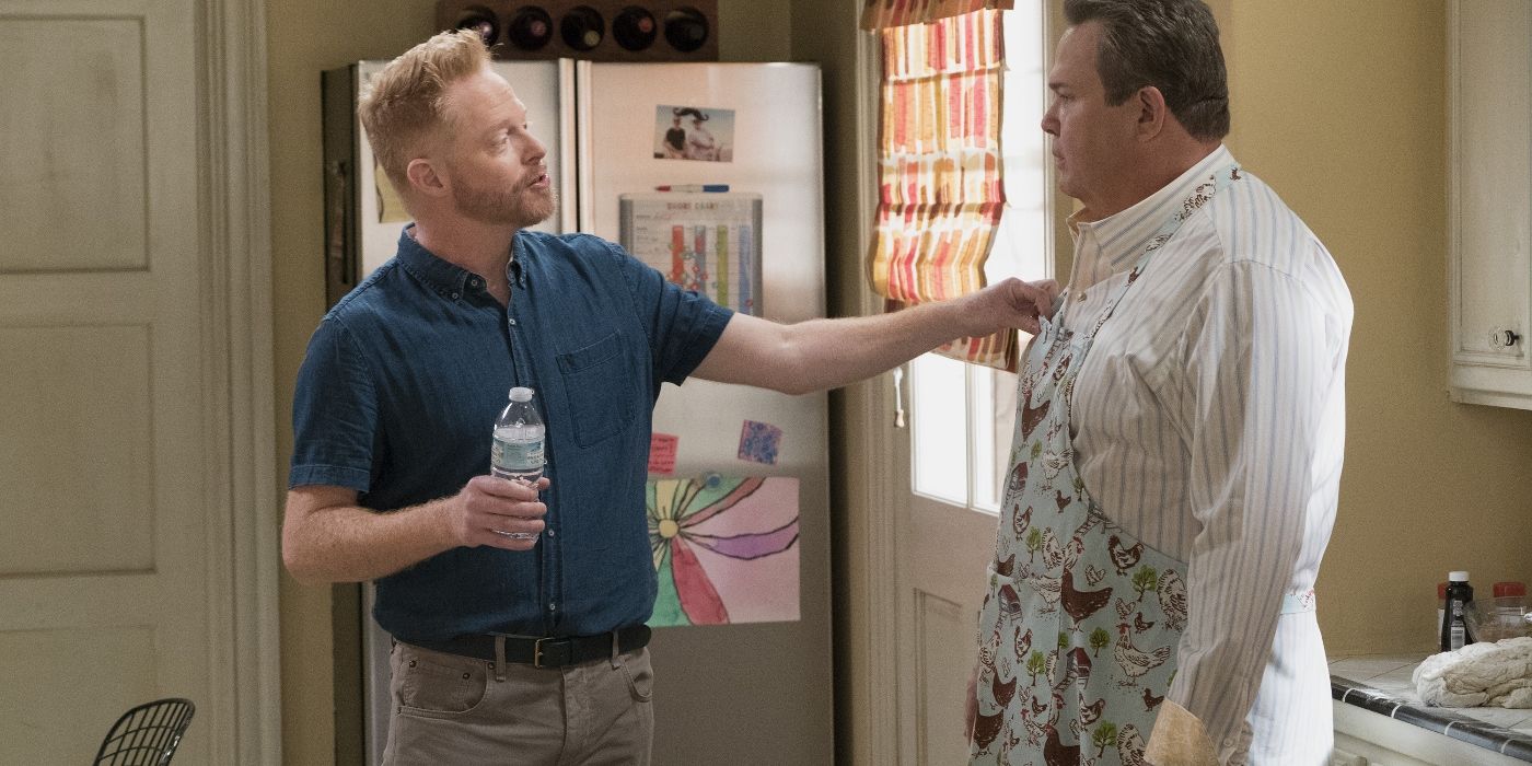Mitch and Cam standing in a kitchen on Modern Family