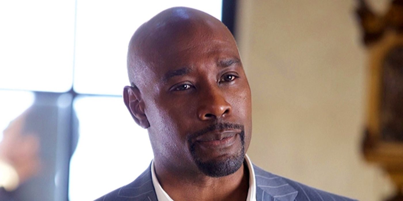 A close-up of Morris Chestnut slightly smiling on Goliath