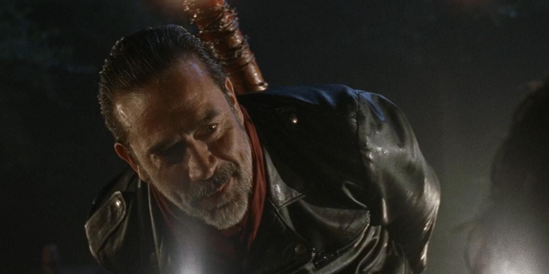 Negan looking down at Glenn in The Walking Dead 