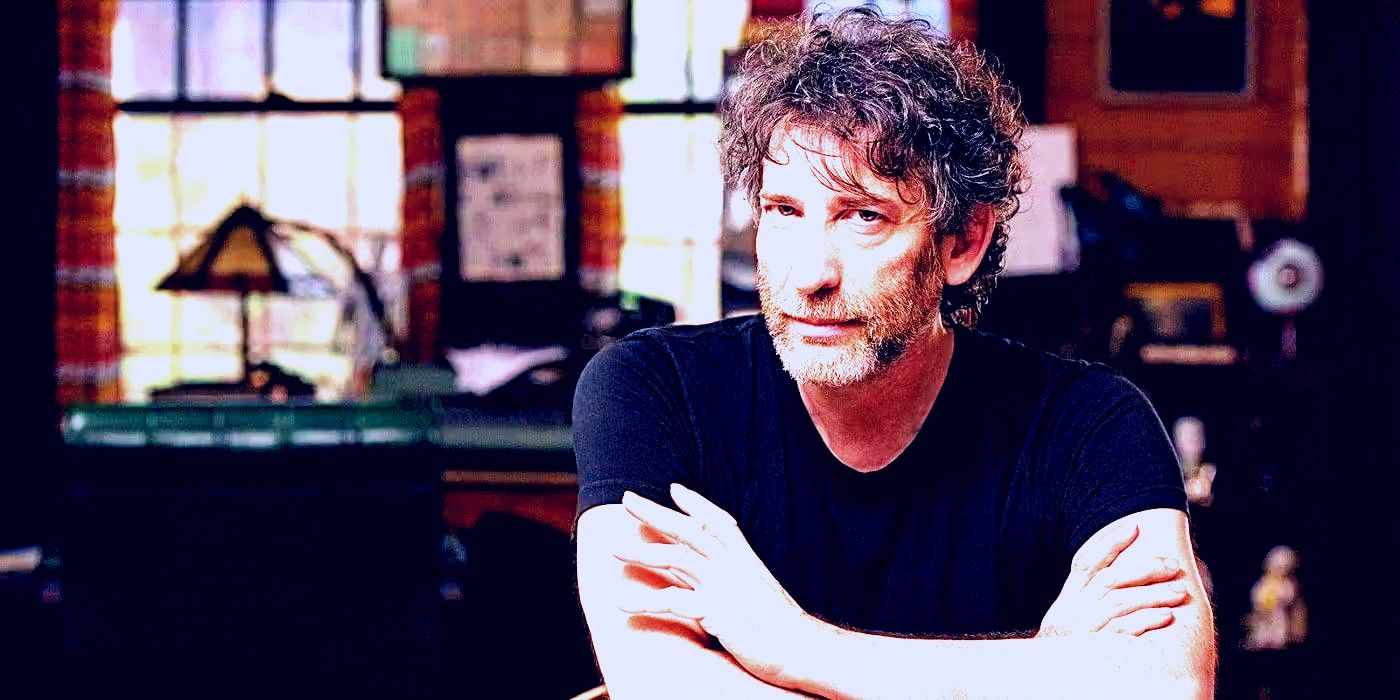 Neil Gaiman sitting, looking at the camera