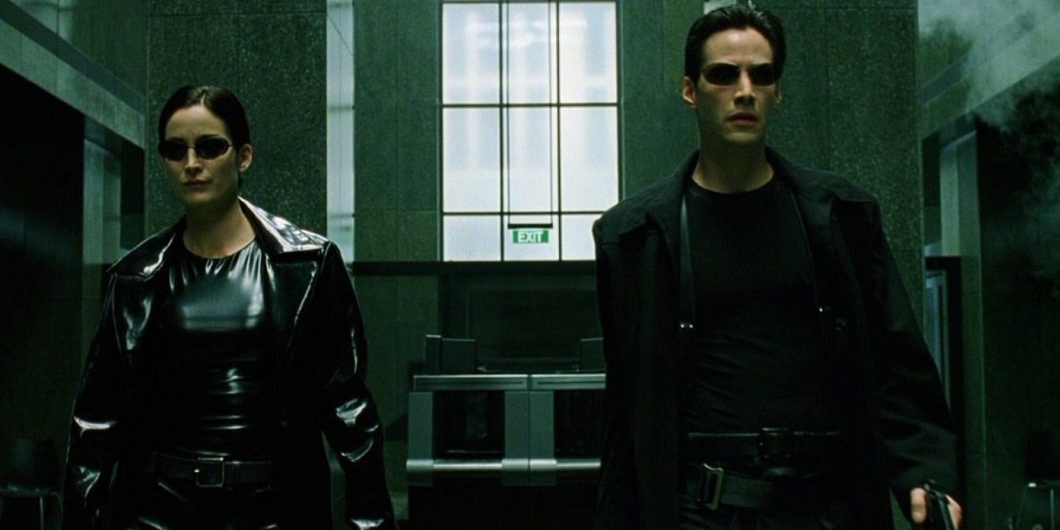 Neo and Trinity shoot up a lobby in The Matrix