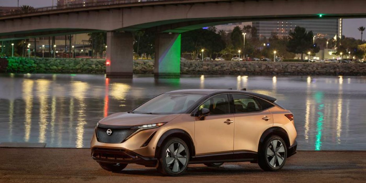 Image of the Nissan Ariya near a city waterfront