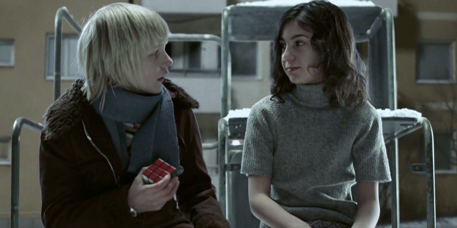 Oskar and Eli hang out in Let the Right One In