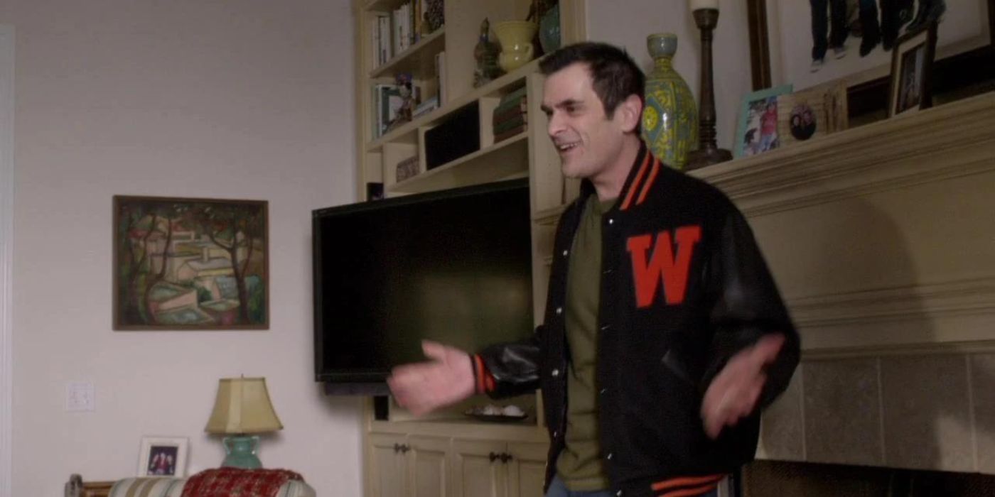 Phil dancing in the living room on Modern Family