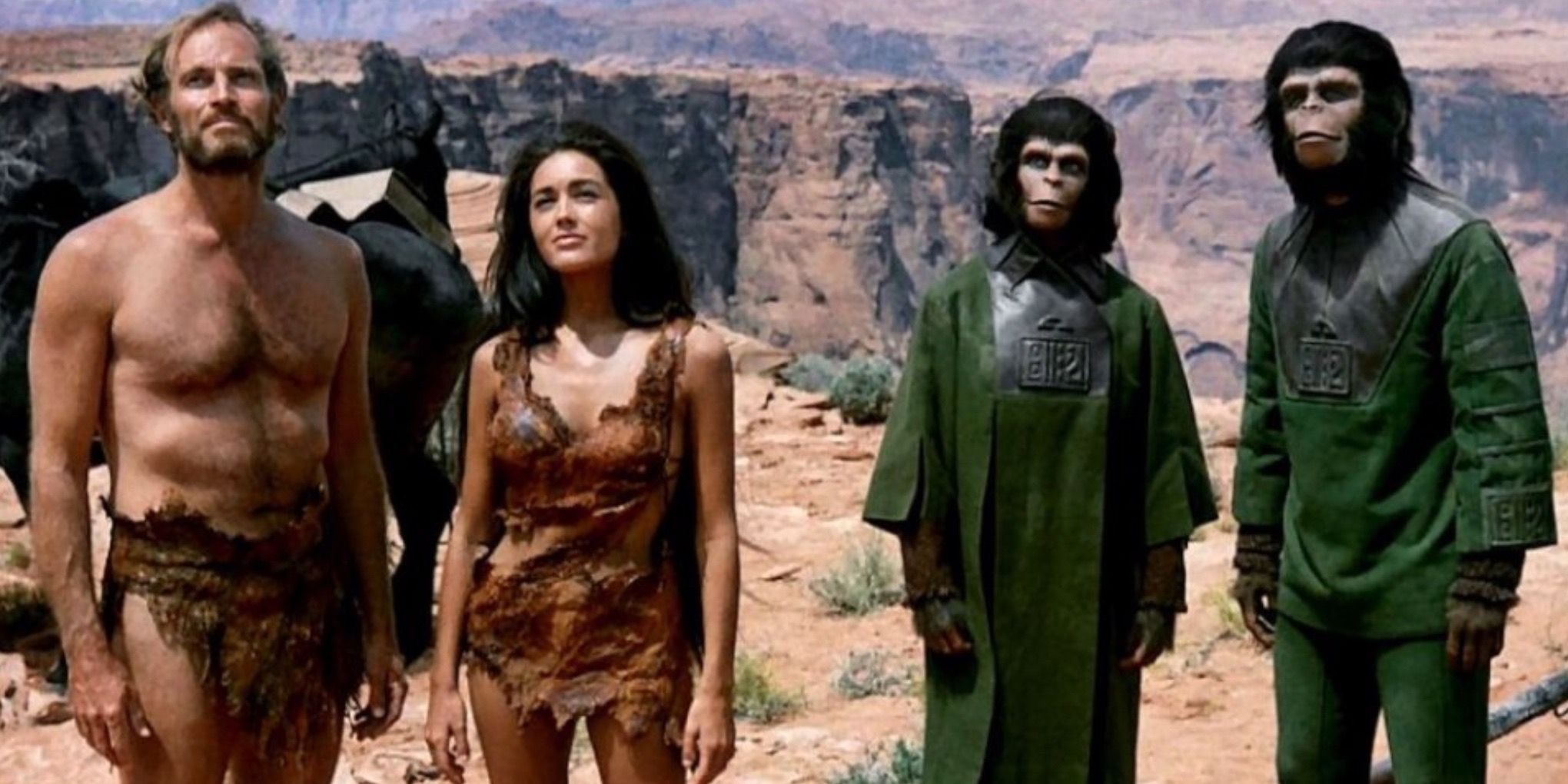 Zira and Cornelius stand with Nova and Taylor in Planet of the Apes