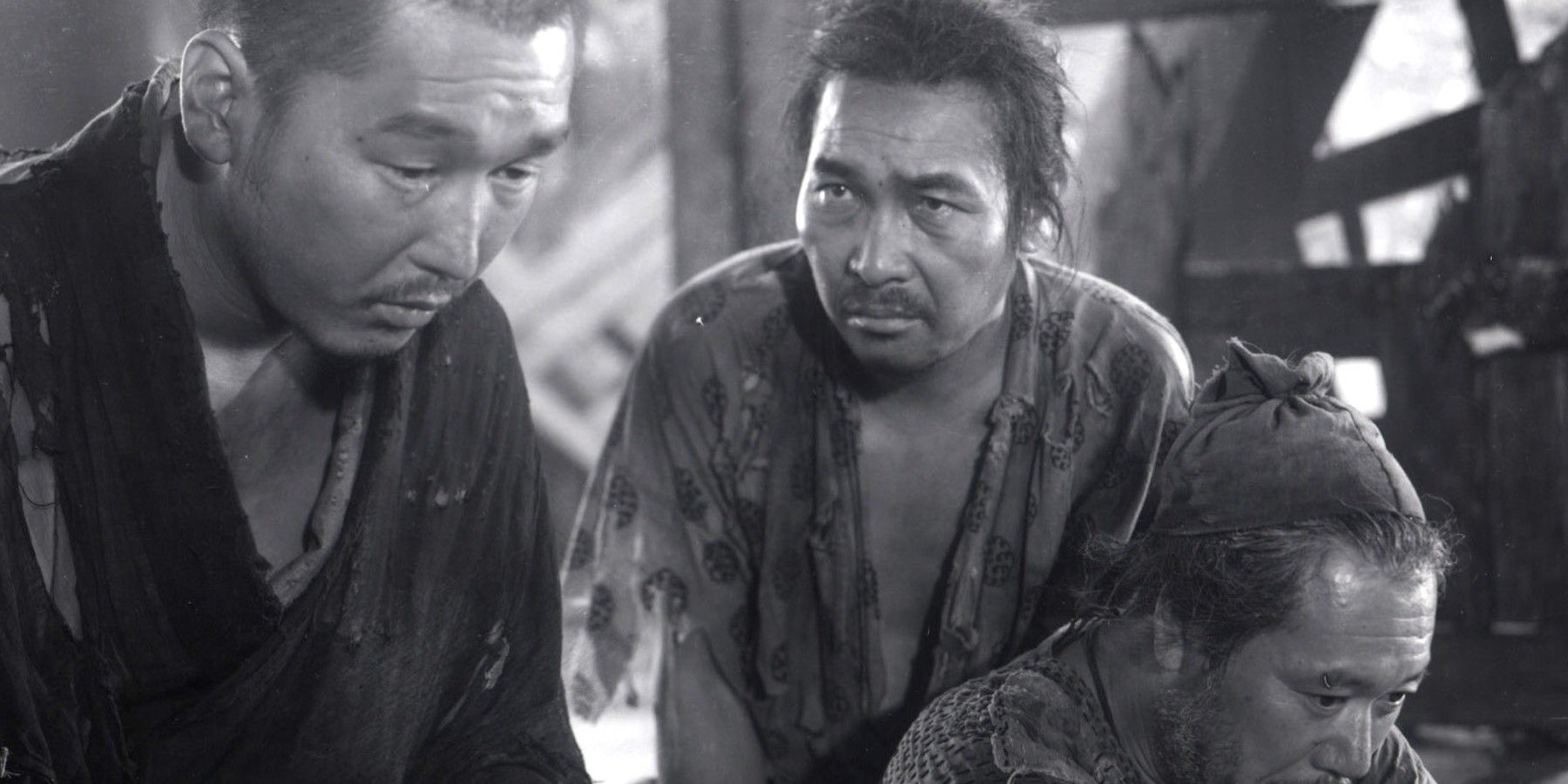 Three men looking sad in Rashomon